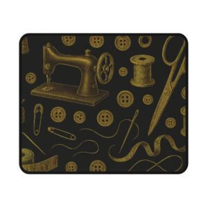 Gold on black sewing mouse mat featuring vintage sewing machines, scissors, thread spools, and buttons — elegant sewing themed desk accessory | By T Larkin.