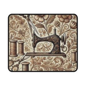 Vintage floral sewing mouse mat featuring a detailed antique sewing machine surrounded by sepia flowers, leaves, and thread spools — elegant sewing themed gift | By T Larkin.