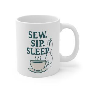 White sewing mug featuring “Sew. Sip. Sleep.” text with needle and teacup design | By T Larkin