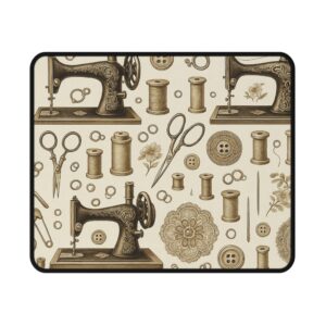 Vintage sewing mouse mat featuring a repeating pattern of antique sewing machines, spools, scissors, and floral details in sepia tones — perfect gift for sewing lovers | By T Larkin.