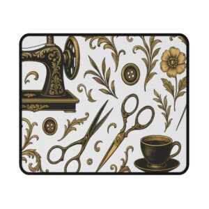 Gold sewing mouse mat featuring vintage scissors, buttons, florals, and a teacup on a white background — elegant sewing themed desk accessory | By T Larkin.